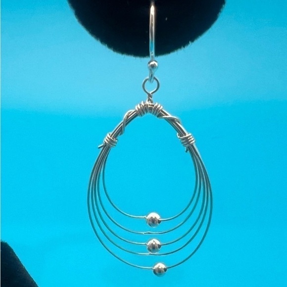 Multi Hoops with moving silver balls dangle earrings. - Picture 9 of 12